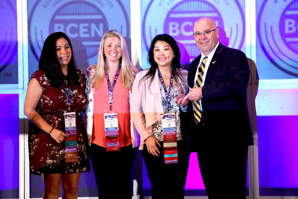 Pictured from L to R: Northeast Georgia Medical Center employees: Yesica Castaneda-Garcia, BSN, RN; Leah Wallace, MHA, BSN, RN, TCRN; and Jackie Payne, BSN, RN, CEN, TCRN accepting the award from BCEN Board of Directors Chairperson-Elect Kyle Madigan