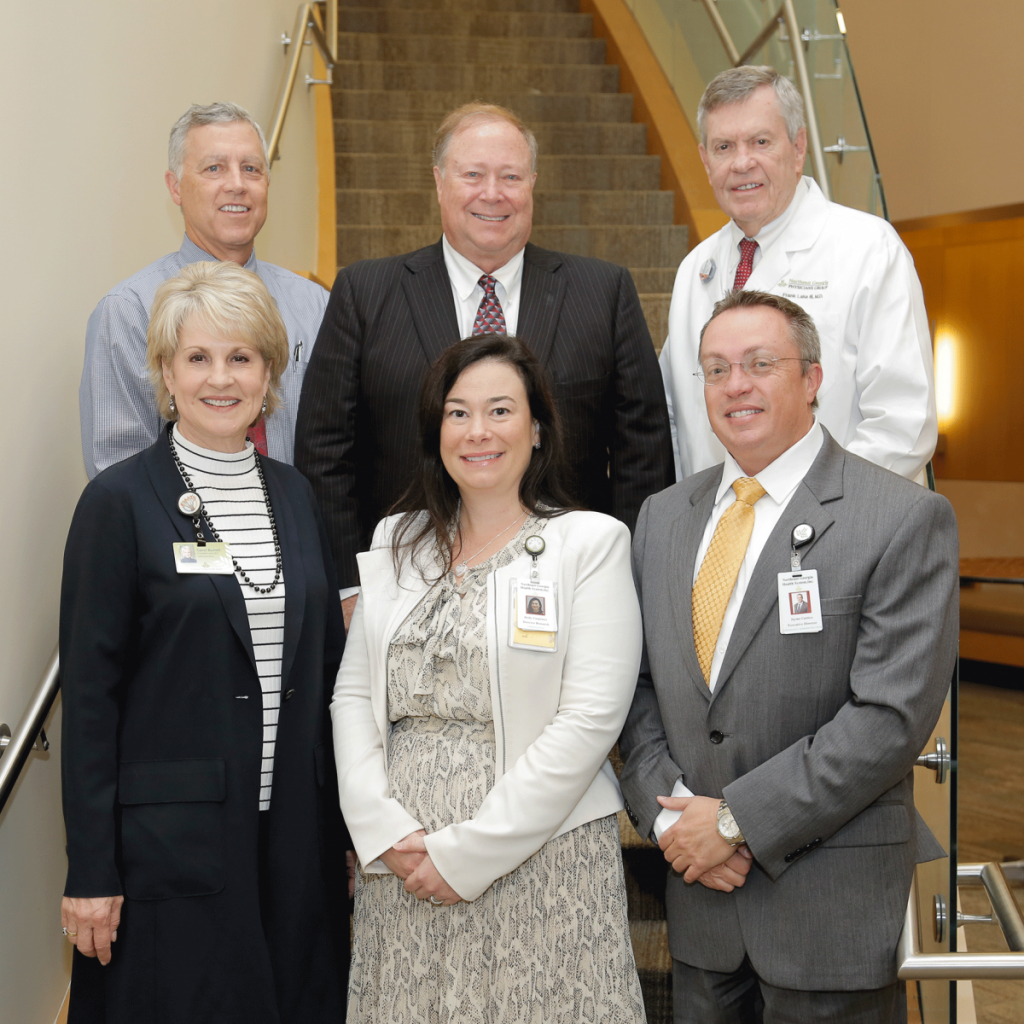 Pictured l to r, front to back: Carol Burrell, president and CEO of NGHS; Holly Jones, director of Research Administration; Jayme Carrico, executive director of Oncology Services; John Turner, vice president of Post Acute Care; Dr. Charles Nash, III