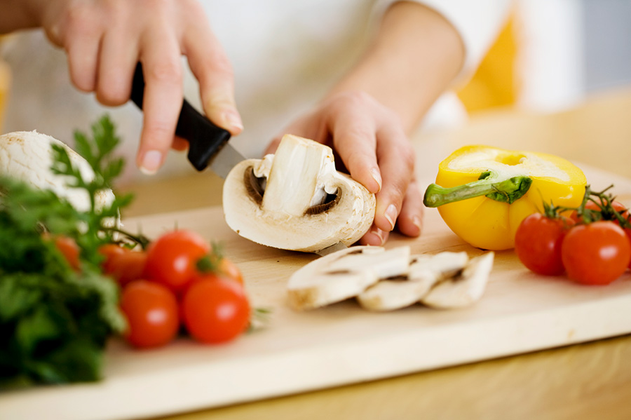 Stock Image cutting up vegetables