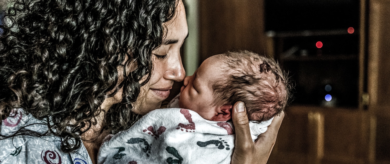 Mother holding new baby