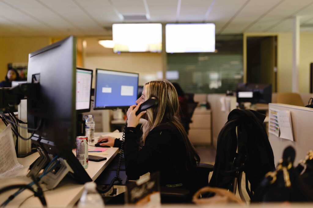 woman answering phone at desk