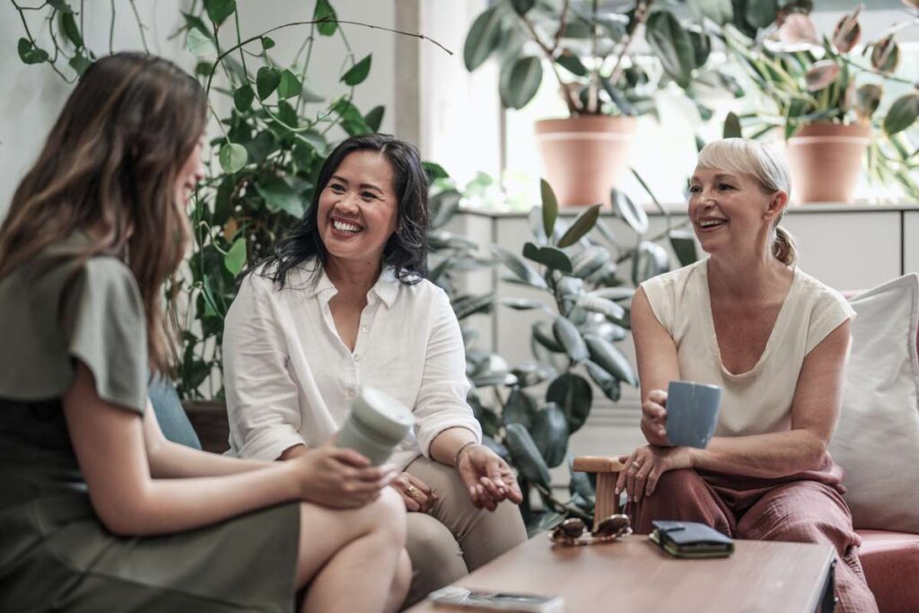 women laughing and chatting together