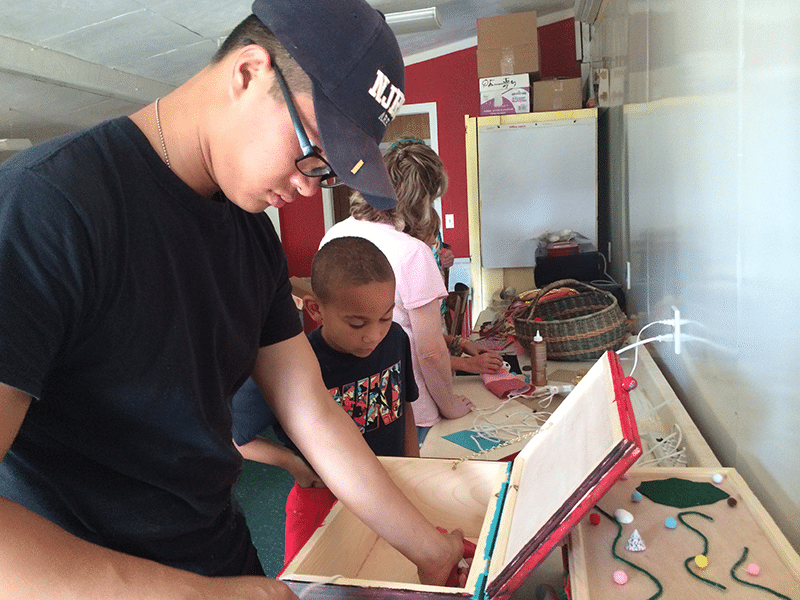 family members creating memory boxes